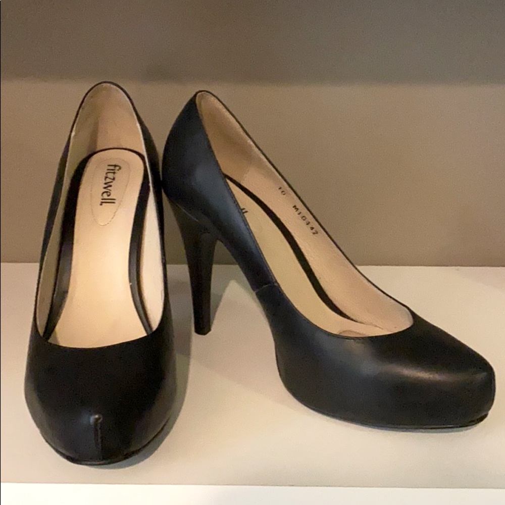 Black leather pumps